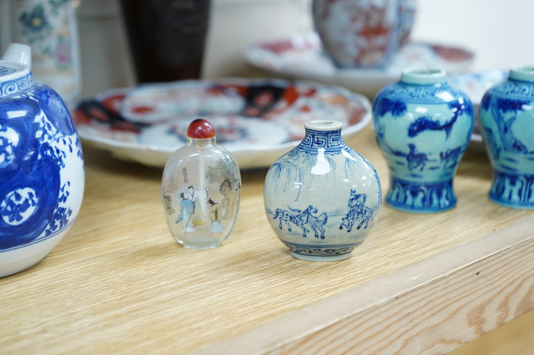 A collection of Asian ceramics to include an inside painted glass snuff bottle, pink ground dish and an Imari dish